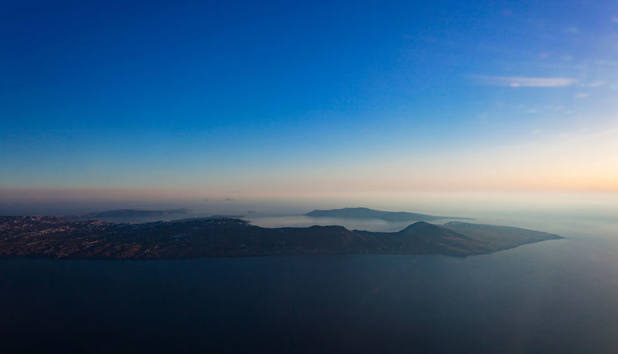 Amazing aerial view of santorini island as seen from plane window.