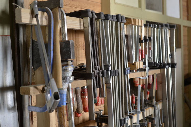 Tools hanging on shelves in workshop