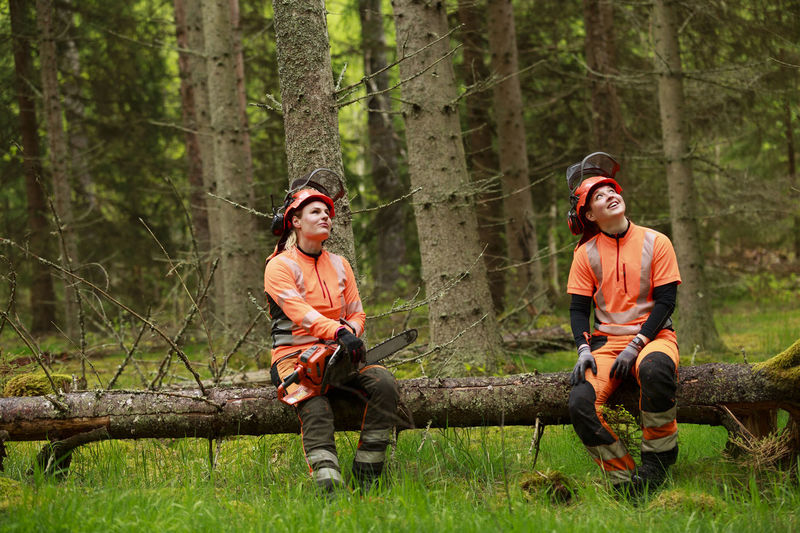 Female lumberjacks resting in forest