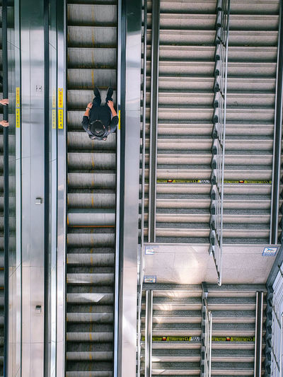 High angle view of man on escalator