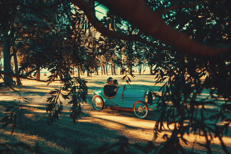 Family in a retro styled car