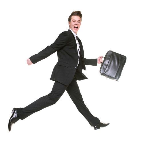 Full length of a young man running against white background