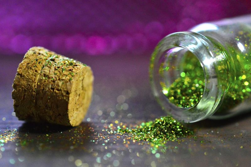 Close up of green glitter in bottle
