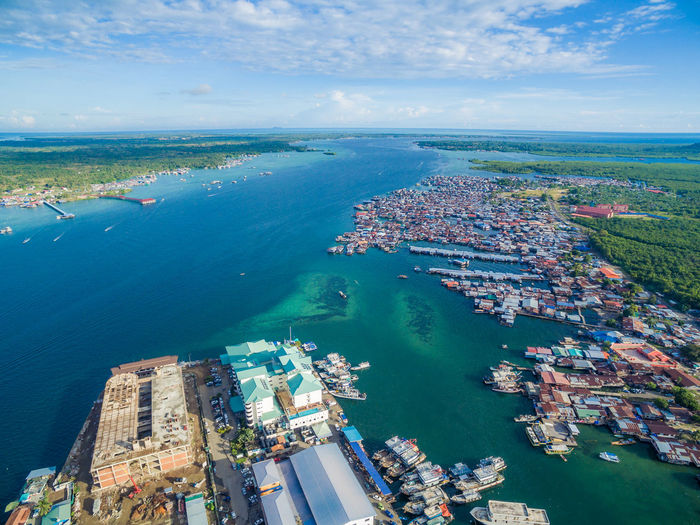 Aerial view of harbor against sky
