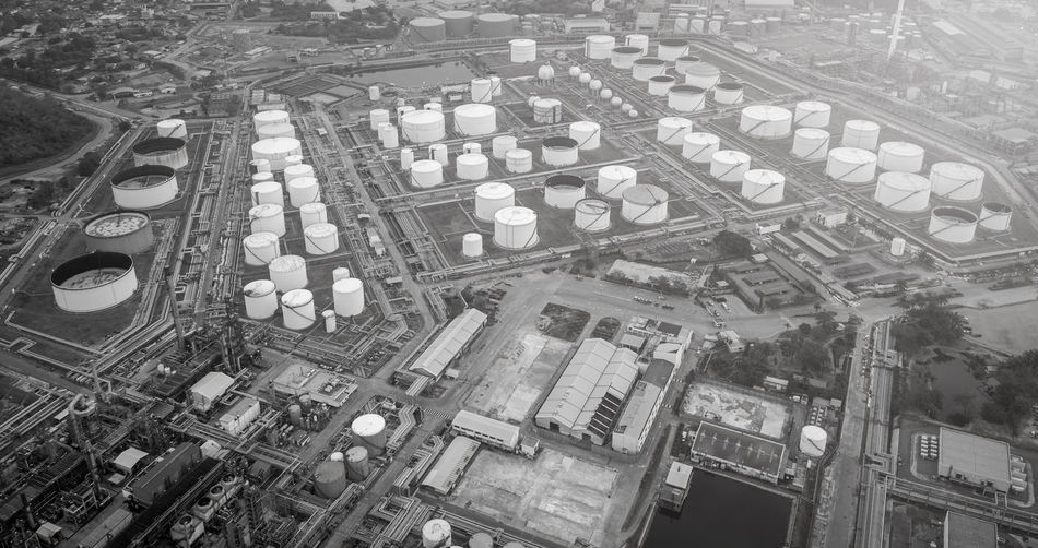 High angle view of refinery buildings in city