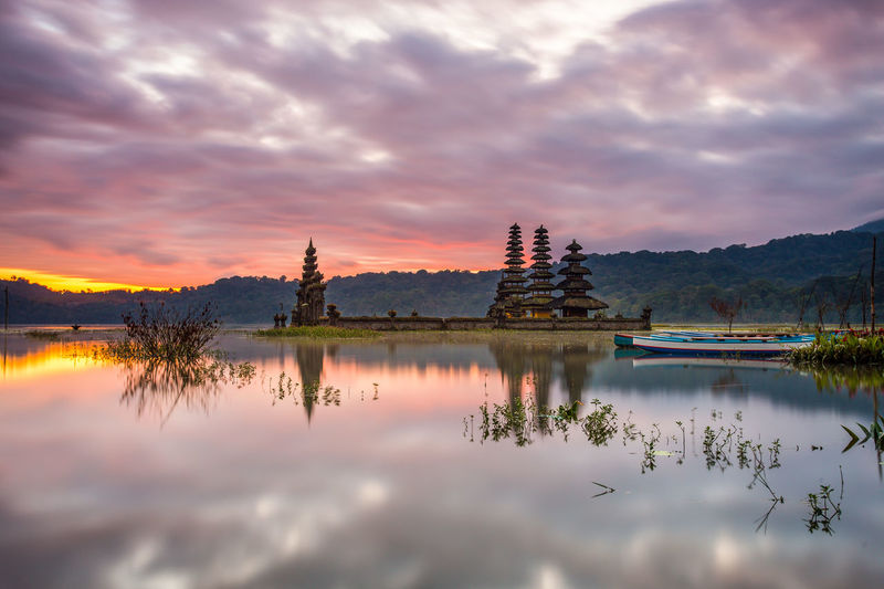 Scenic view of lake against sky during sunset