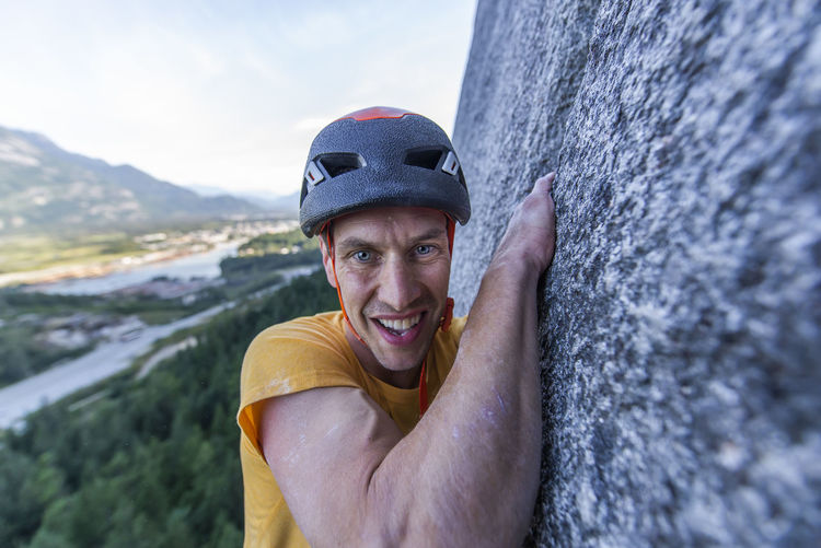 Man struggling lead climbing in off-width climb on granite squamish