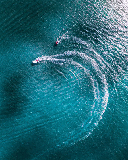 Aerial view of motorboats sailing in sea