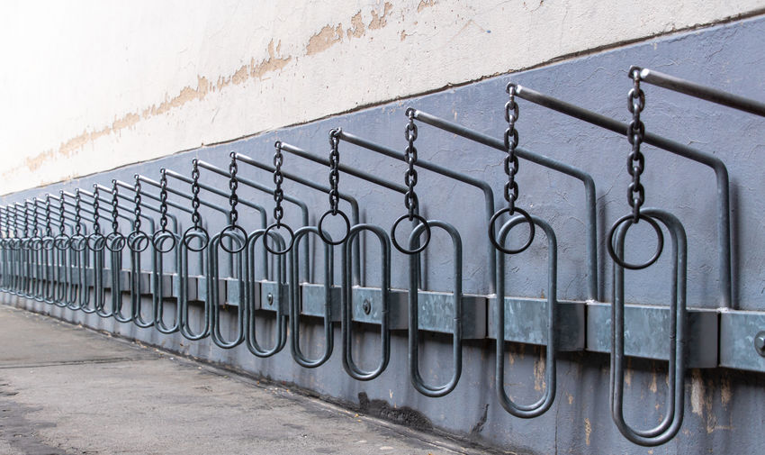 Close-up of bicycle rack against wall