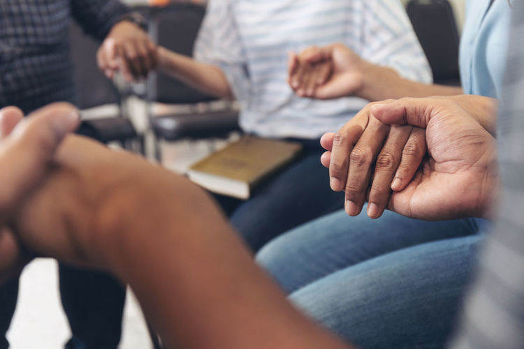 Close-up of people holding hands