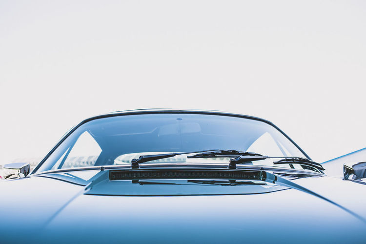 Close-up of vintage car against white background