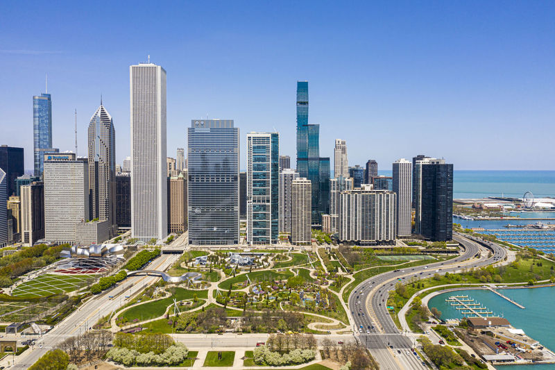 Panoramic view of modern buildings against clear sky