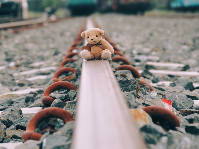 Close-up of small stuffed toy on metal