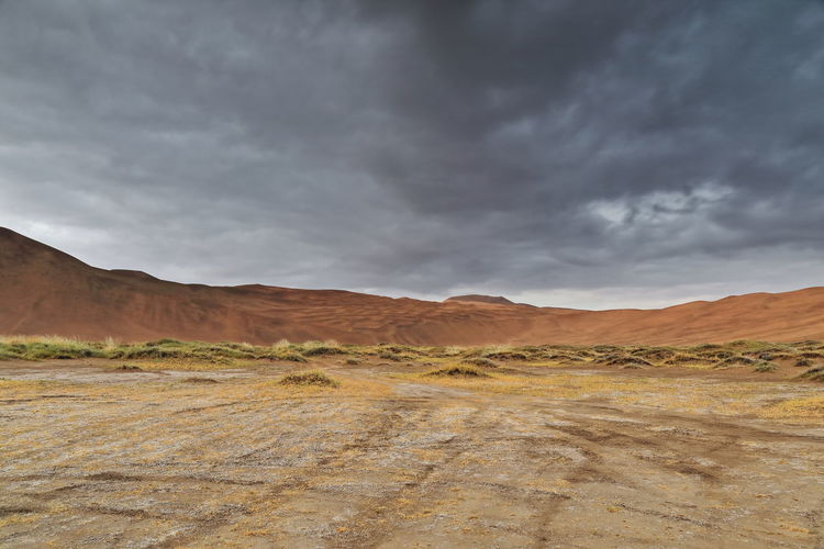 1120 sumu jaran lakebed among badain jaran desert megadunes-sunset leaden sky -inner mongolia-china.