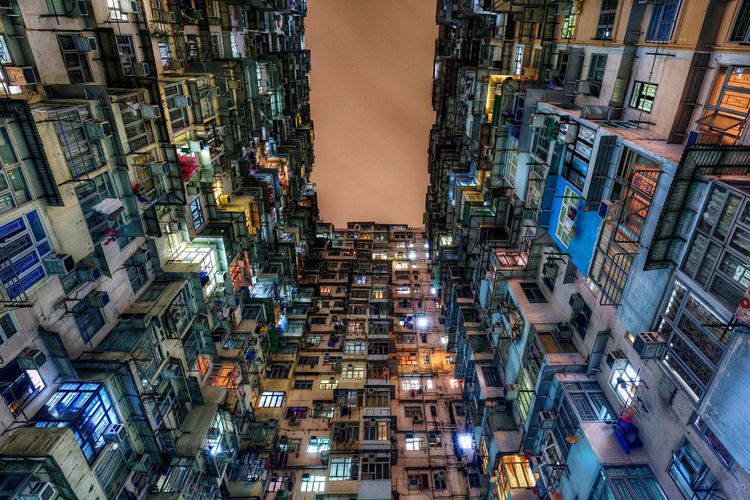 Low angle view of montane mansiona at quarry bay in city during night