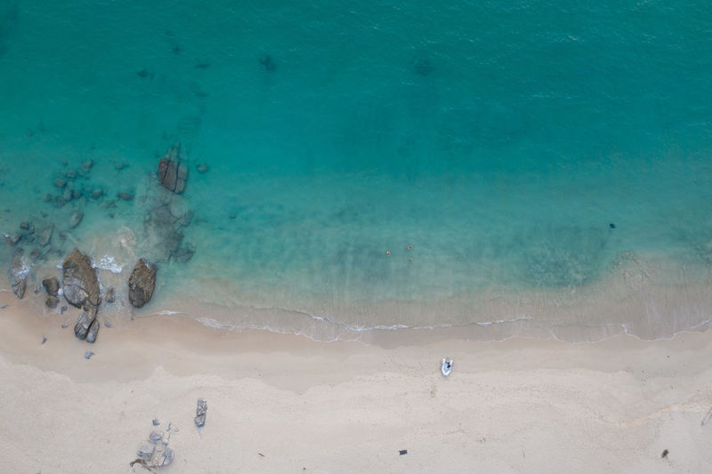 High angle view of people swimming in sea