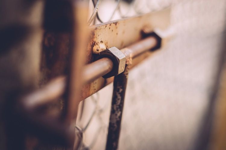 Close-up of rusty latch on door