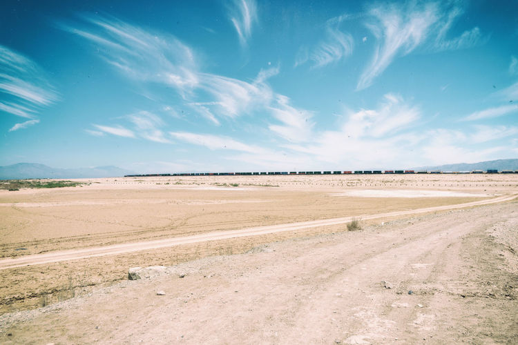 Scenic view of landscape against blue sky