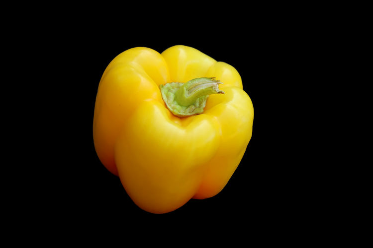 Close-up of yellow bell pepper against black background