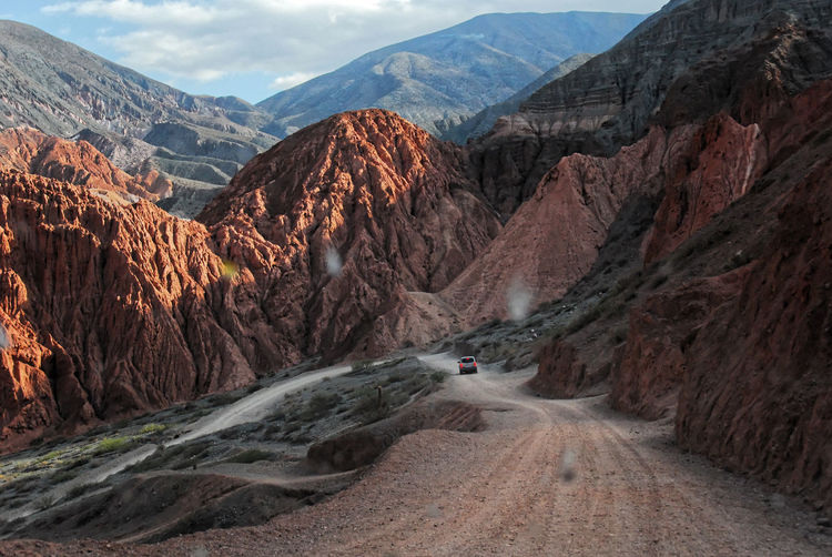 Driving through on road through colored mountains near purmamarca argentina 