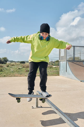 Full length of boy skateboarding
