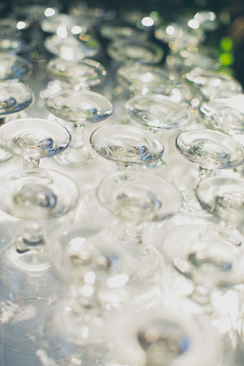 High angle view of upside down wineglasses at wedding reception