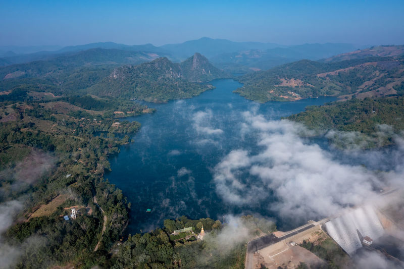 Beautiful landscape aerial view mae suai dam or reservoir in valley mountain and blue sky background 
