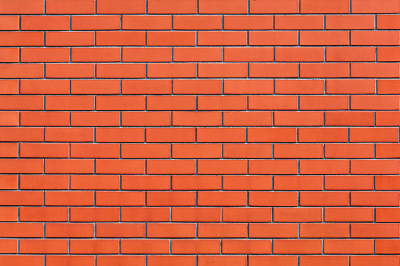 Full frame shot of orange brick wall