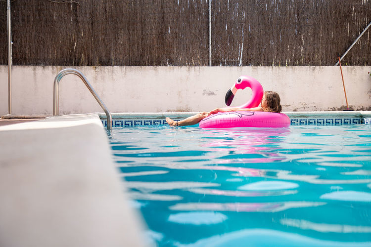 Woman swimming in pool