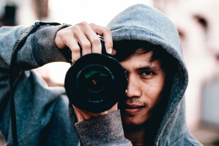 Portrait of man photographing