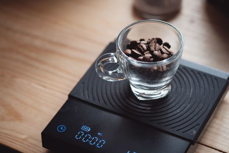 Coffee bean on digital scale in morning