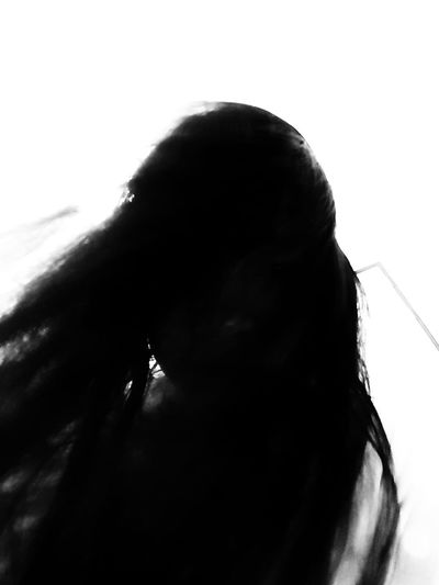 Close-up portrait of silhouette woman against white background
