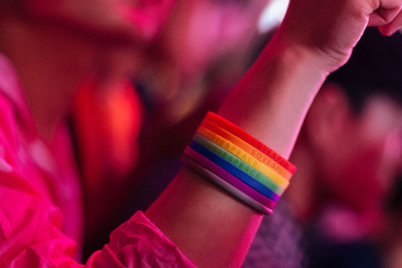 Close-up of woman wearing colorful wristbands