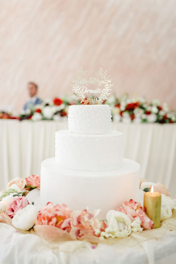 Close-up of wedding cake  on table