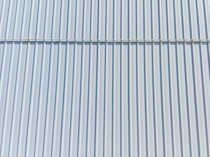 Full frame shot of patterned wall.the steel wall of the building texture background. 