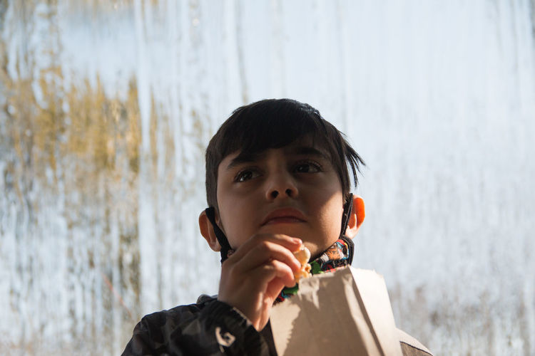 Portrait of child eating popcorn