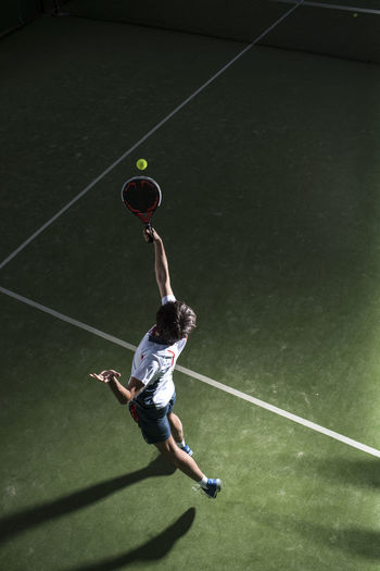 High angle view of man playing with ball