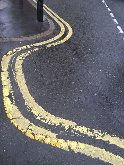 High angle view of double yellow line on road
