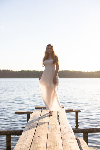 Rear view of woman looking at lake