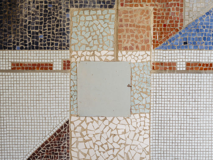 Full frame shot of tiled floor by wall