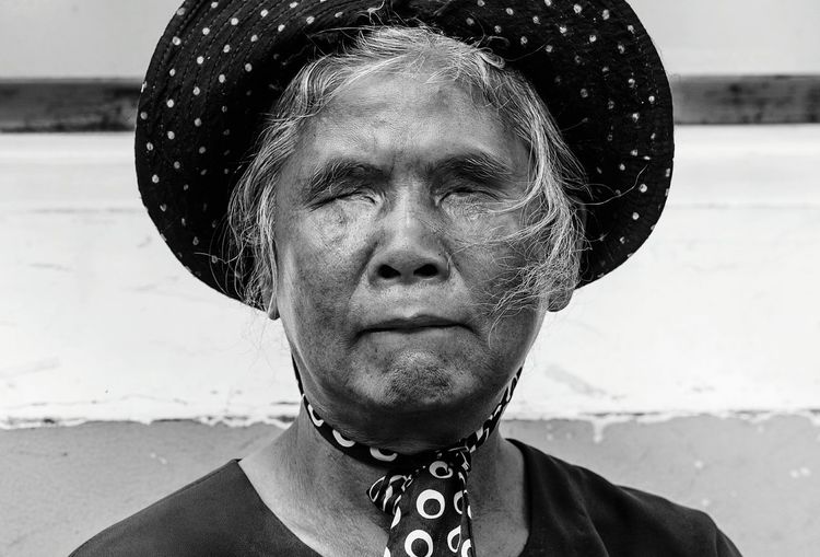 Close-up of blind woman wearing hat