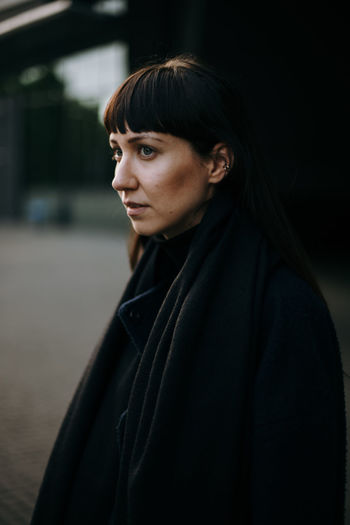 Close-up of young woman standing outdoors