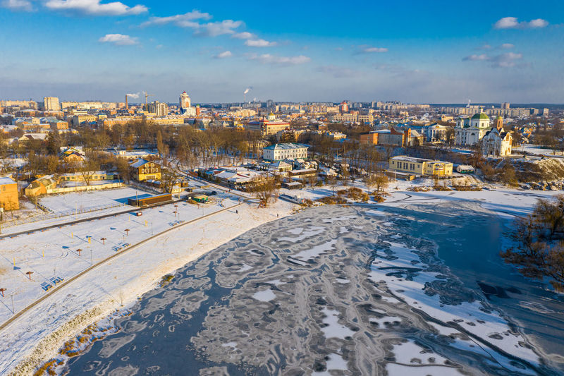Nice top view of the winter city. bridge over river. orthodox churches and a catholic cathedral.