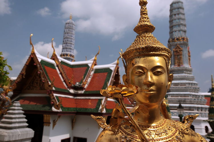 Golden kinnara statue at wat phra kaeo