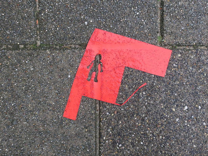 High angle view of arrow sign on road in city