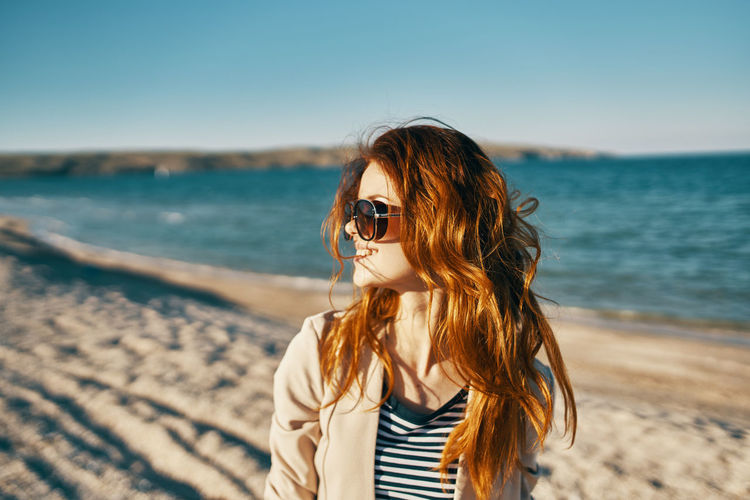 Young woman wearing sunglasses on beach
