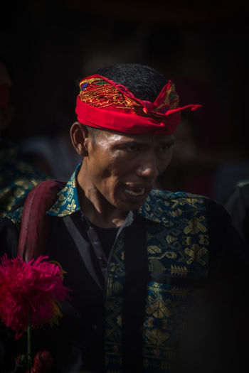Close-up of man in traditional clothes