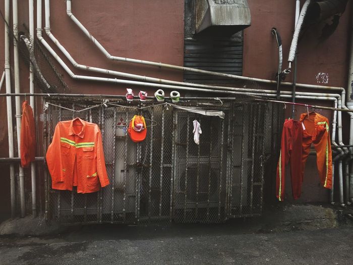 Firefighter uniforms hanging on railings