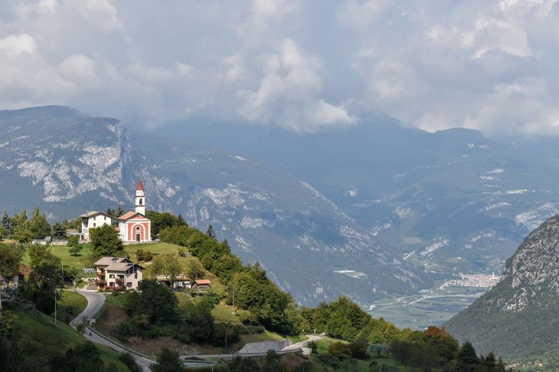Panoramic view of buildings and mountains against sky