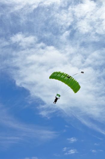 Person paragliding against sky